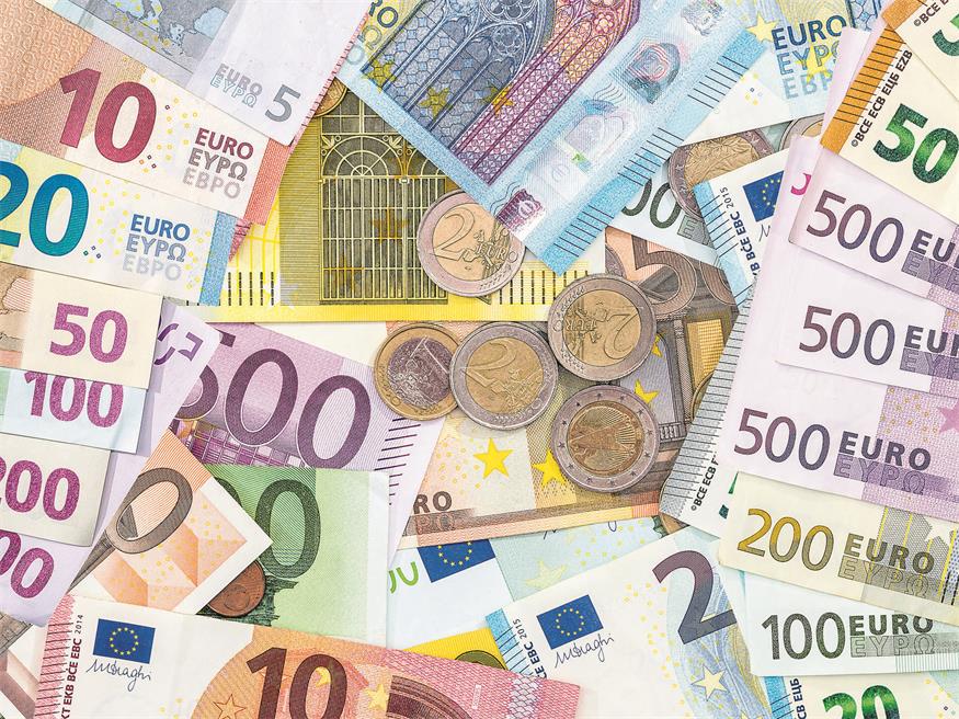 pile of different paper euro banknotes and coins cent. Saving concept